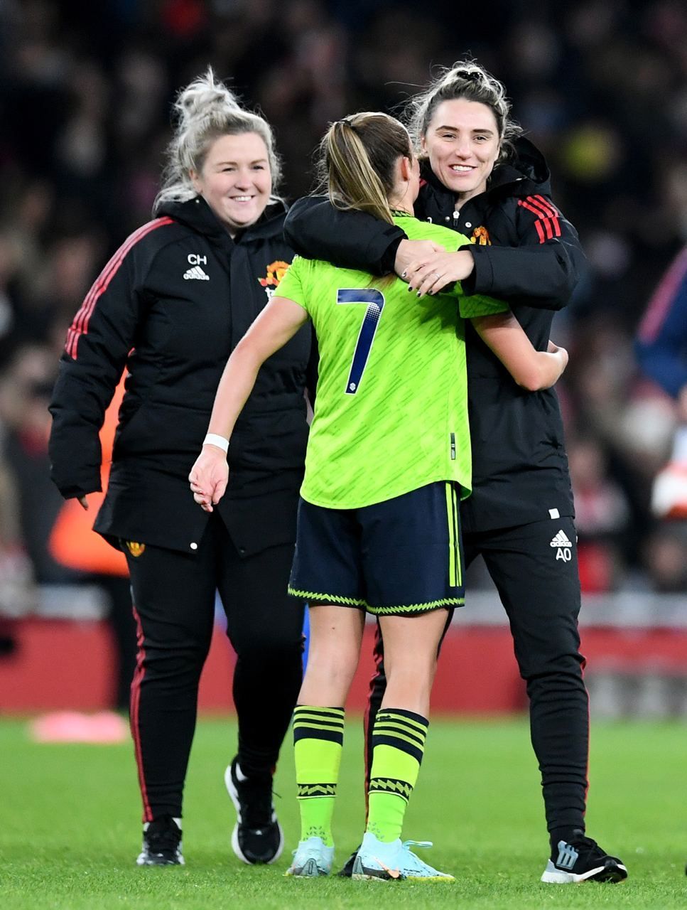aimee o'keeffe, man u's nutritionist, hugging a player on the pitch