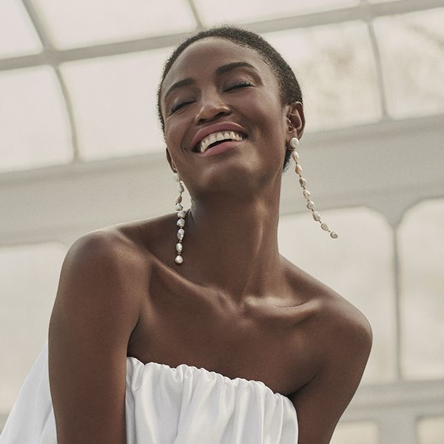 a model wears an et ochs look with drip earrings in an intermix shoot in a roundup of the best bridal earrings 2022