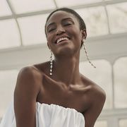 a model wears an et ochs look with drip earrings in an intermix shoot in a roundup of the best bridal earrings 2022