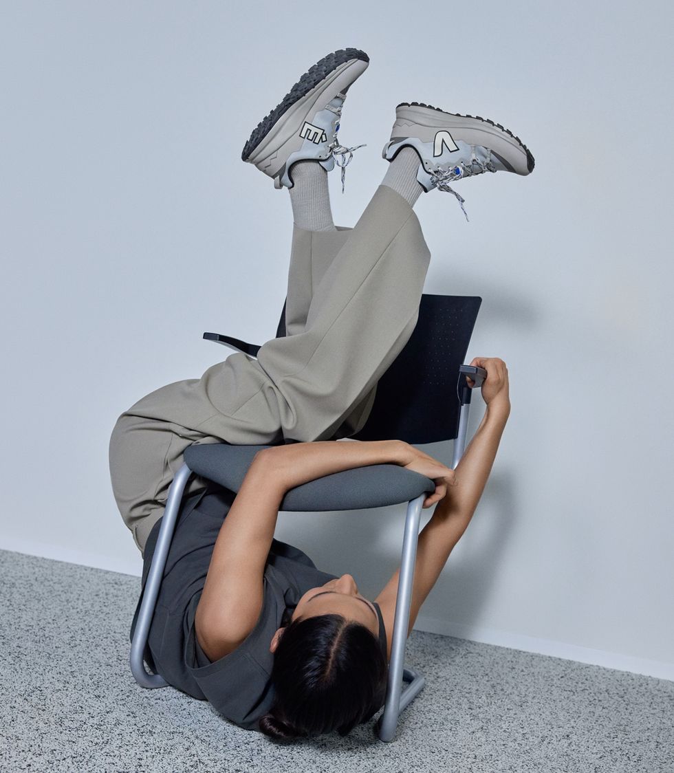a person lying on a chair