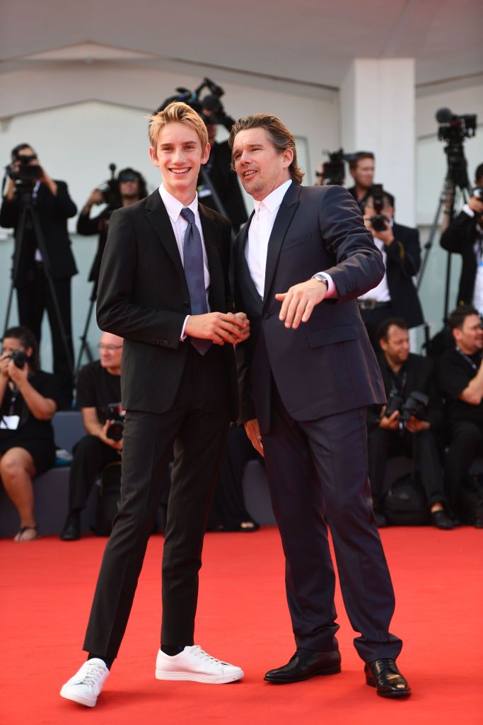 venice, italy august 31 actor ethan hawke wearing a jaeger lecoultre master ultra thin moon watch with his son levon roan thurman hawke l walks the red carpet during the first reformed premiere during the 74th venice film festival at sala grande on august 31, 2017 in venice, italy photo by ian gavangetty images for jaeger lecoultre