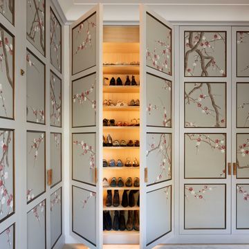 a room with white doors and shelves