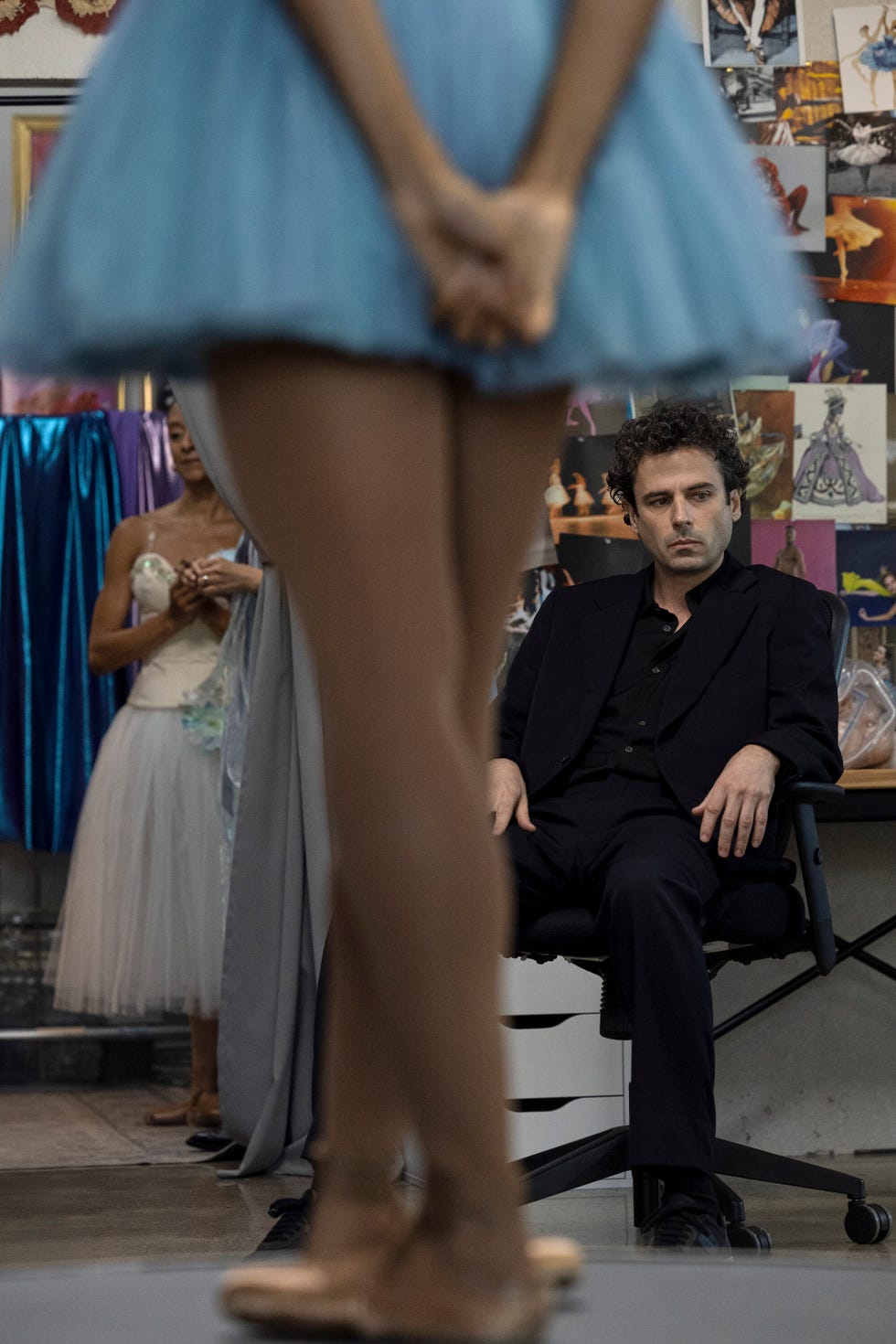 man looking at ballerina