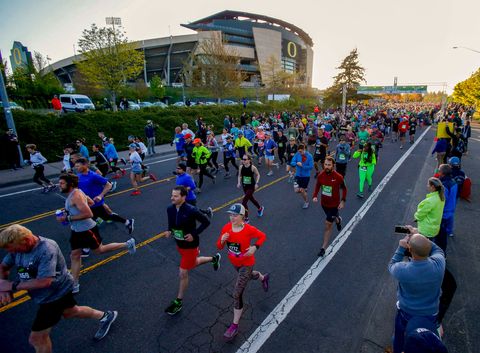Runners start the Eugene Marathon in front of Autzen Stadium Sunday, April, 28, 2019.