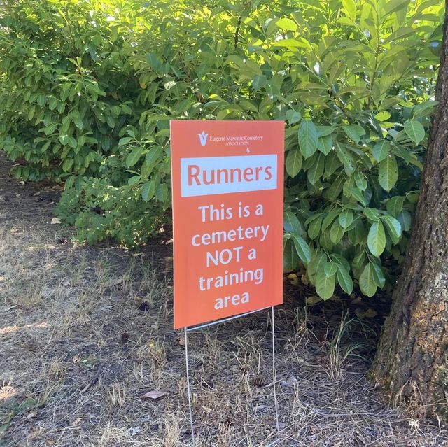 runners this is a cemetery not a training area sign