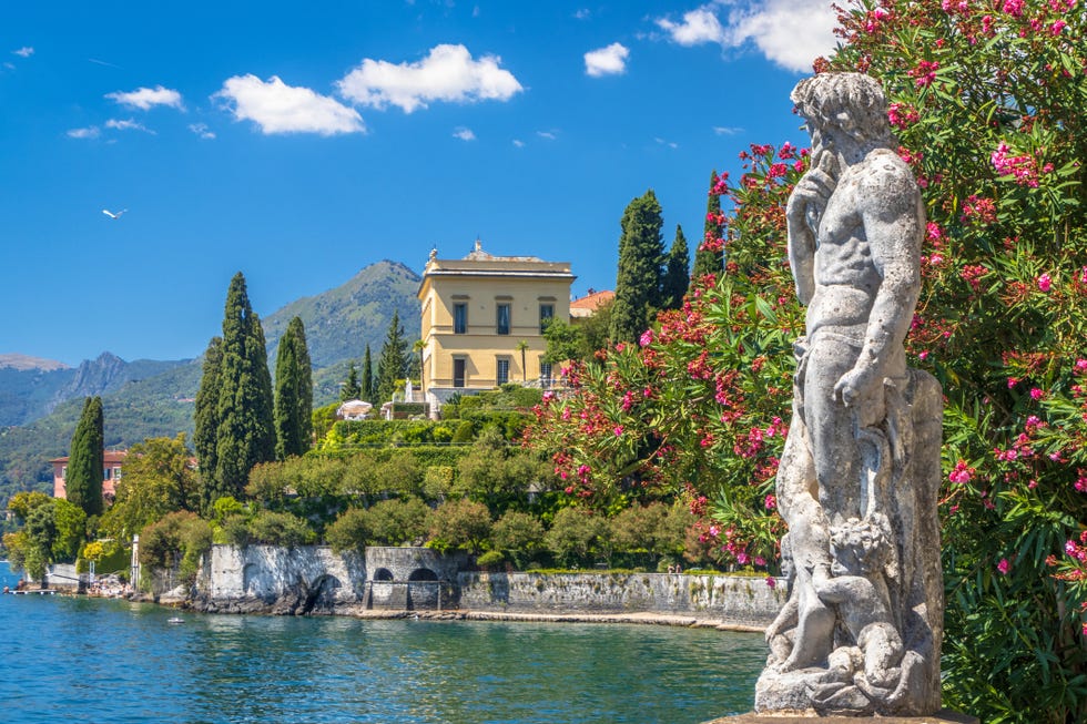 a roman statue in the botanical garden of villa monastero, overlooking lake como, in varenna, lecco province, lombardy region, northwestern italy