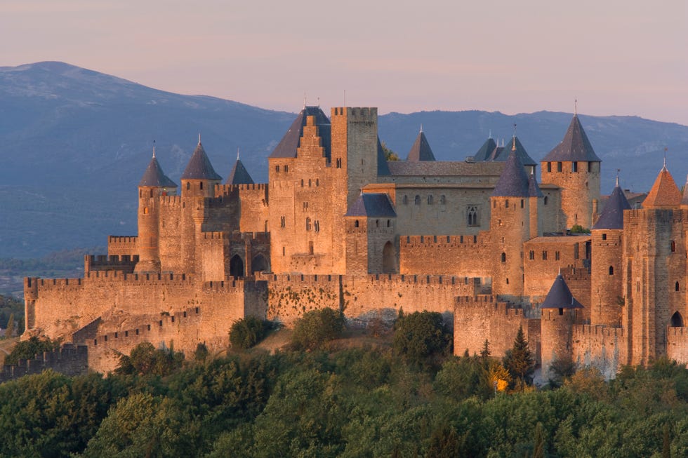 France, Languedoc, Carcassonne, castle on top of hill at sunset france, languedoc, carcassonne, castle on top of hill at sunset