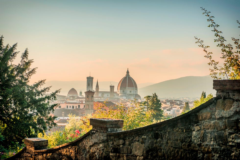a view of florence old town with the duomo and the bell tower in the background