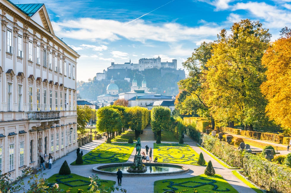 beautiful view of the famous Mirabell Gardens with the historic old Hohensalzburg Fortress in the background in Salzburg, Austria