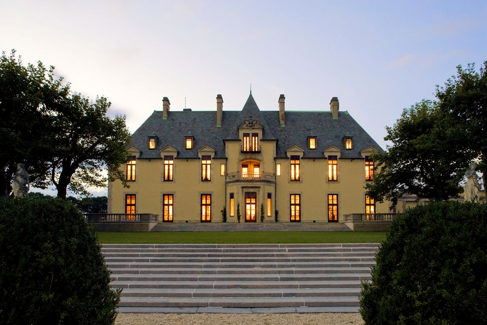 evening view of chateau like early 20th century estate that has been turned into a hotel
