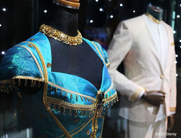 Turquoise, Display window, Formal wear, Mannequin, Fashion accessory, Metal, Costume, Jewellery, 