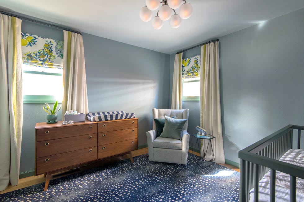 brightly lit nursery with modern furniture and decor
