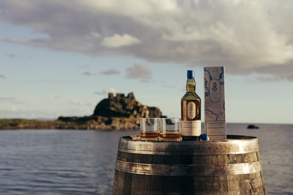 a bottle of wine on a barrel