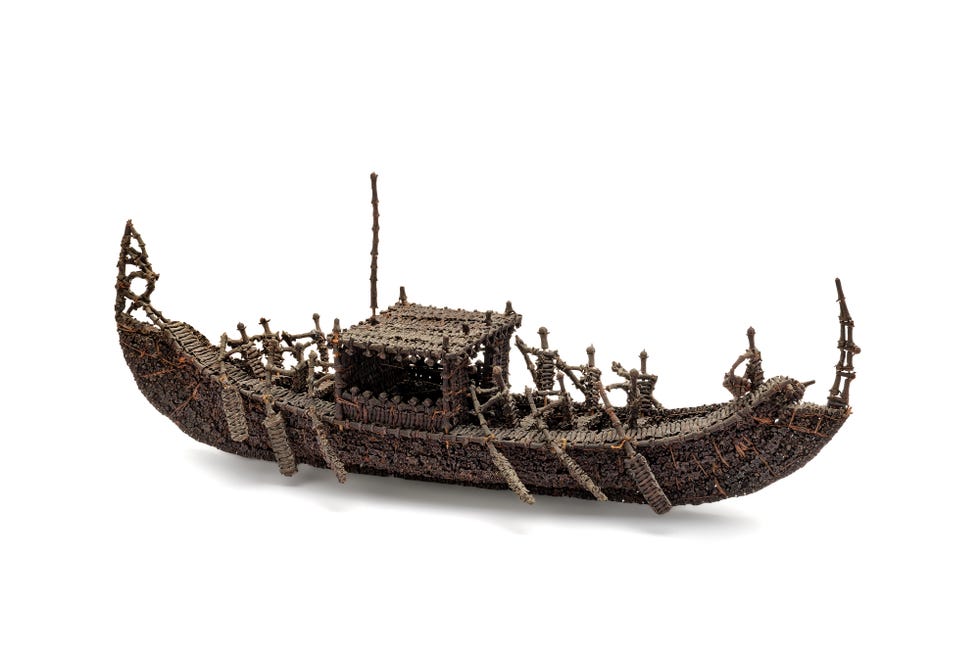 A traditional boat model crafted from natural materials