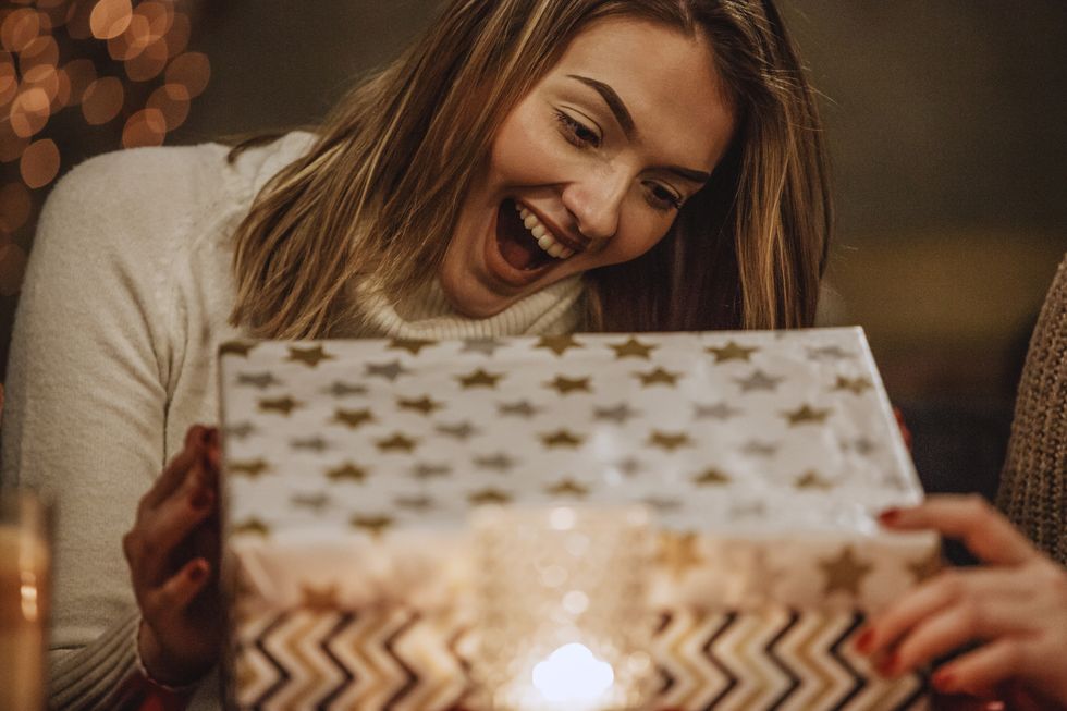 excited woman opening a present