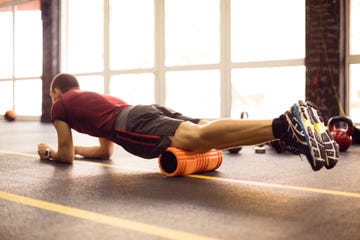 exercising with foam roller in the gym