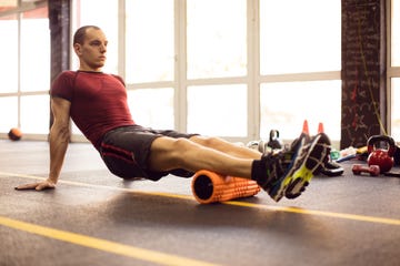 Exercising with foam roller in the gym