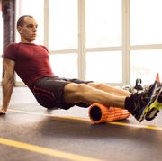 Exercising with foam roller in the gym