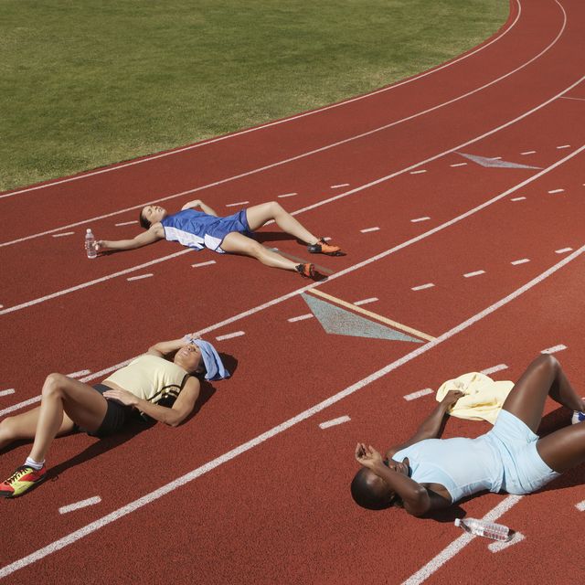 exhausted runners on track
