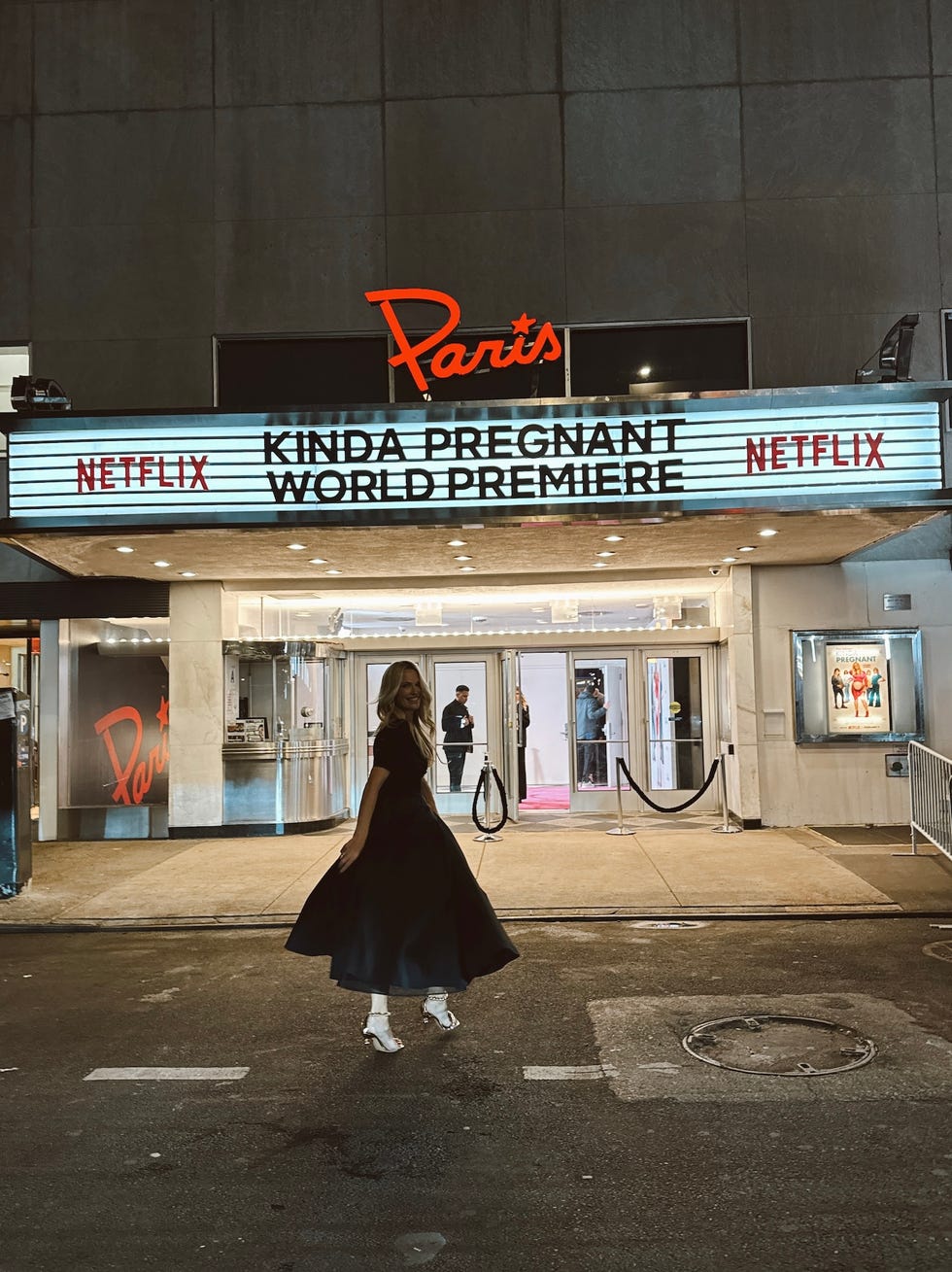 molly sims posing outside the paris theater featuring the film kinda pregnant