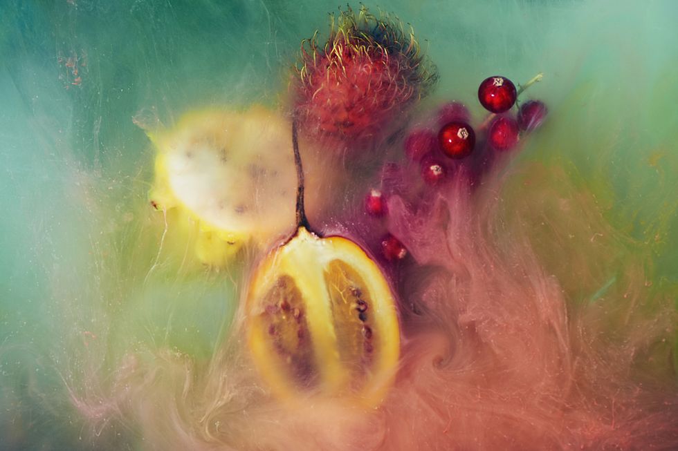 exotic fruit and paint shot underwater