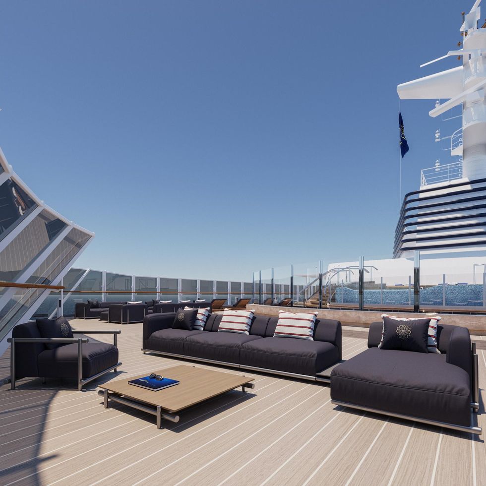 a deck with a large ship in the background