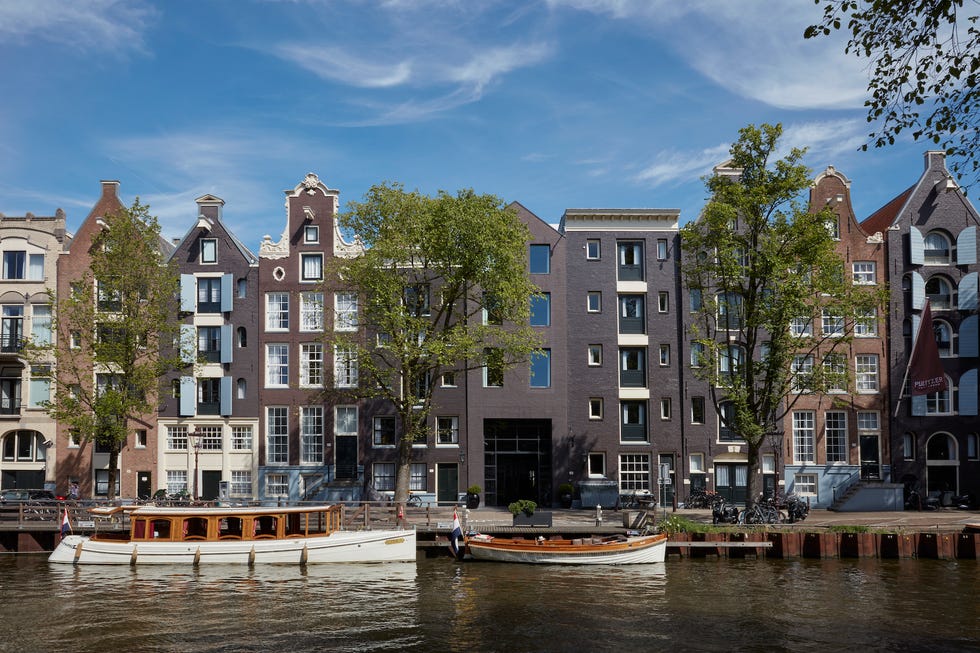 a group of buildings next to a body of water