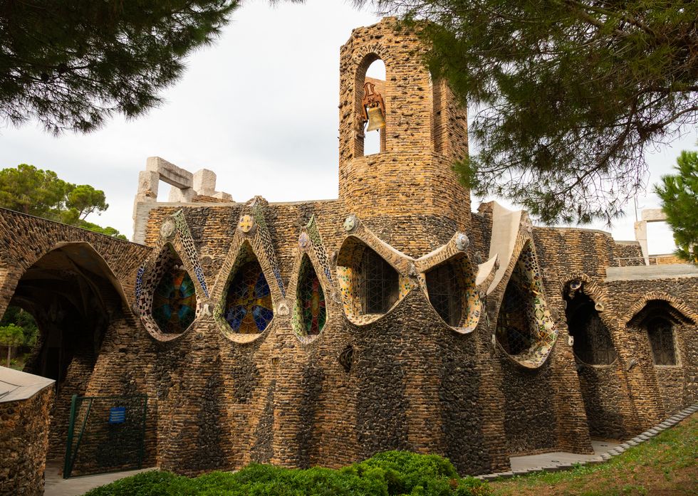 exterior view of guell crypt, masterpiece gaudi architecture located at catalunya outside town