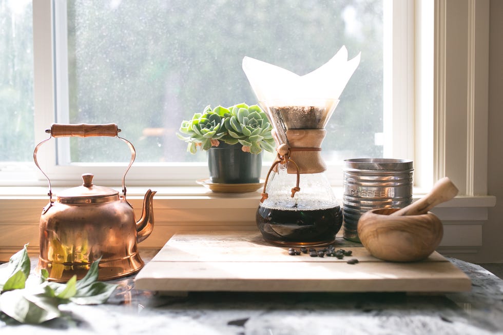 eye level view of coffee and kettle and succulent