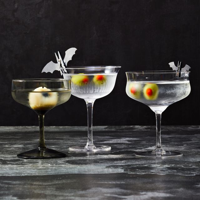 martini glasses with stuffed olives and lychee that look like eyeballs for halloween