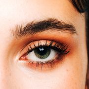 person with dark brown eyebrows and green eyes