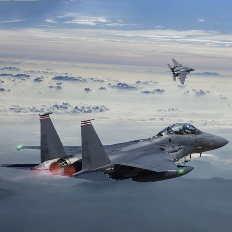 f 15 eagle fighter jets in flight above the fogy mountains