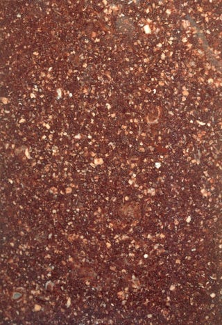 Plum-toned porphyry rock