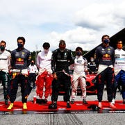 formula 1 drivers standing at start finish line formula 1 drivers standing at start finish line