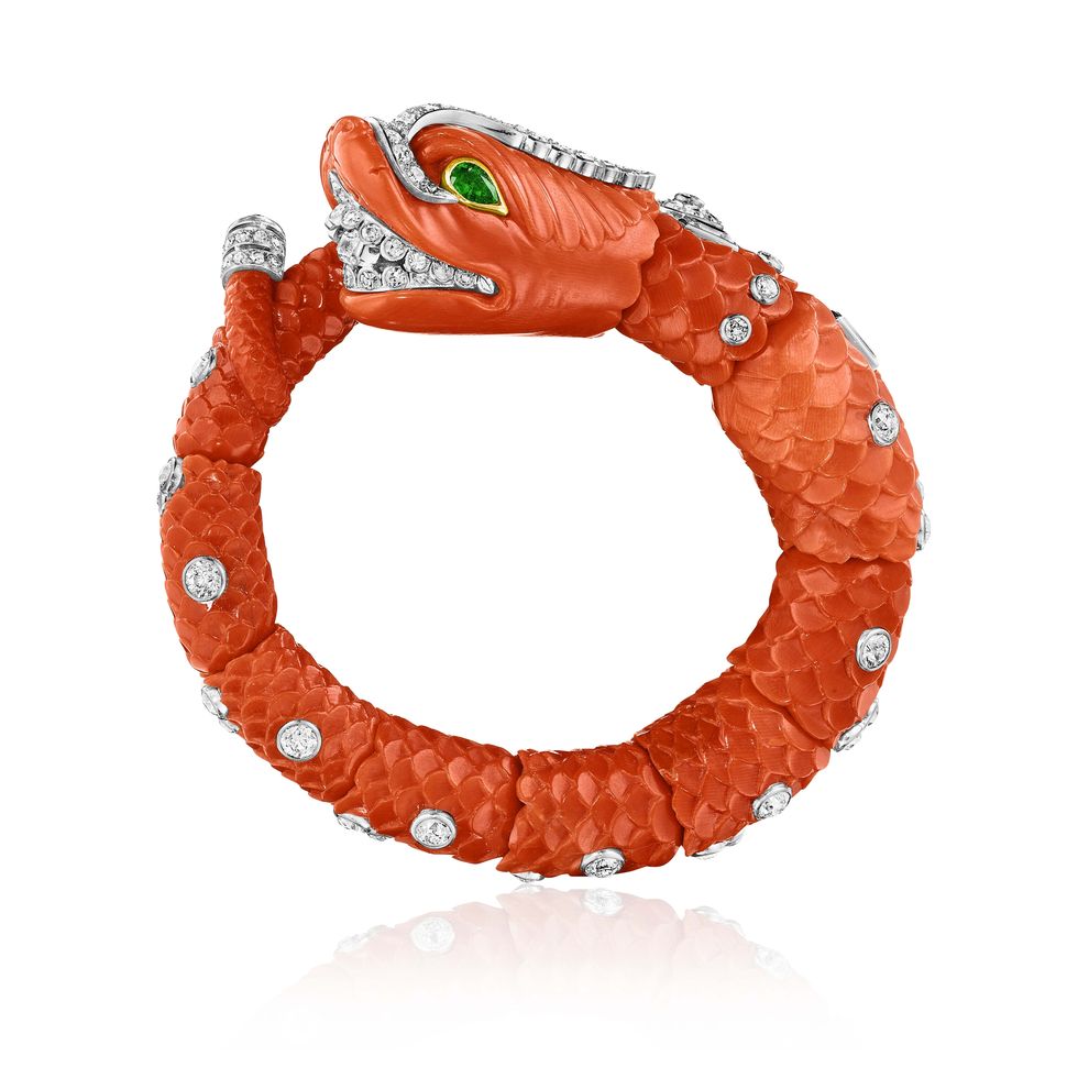 carved coral, emerald, and diamond chimera bangle by cartier, paris, circa 1960