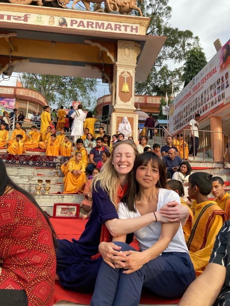 allie early and katherine han at the arati ceremony in rishikesh