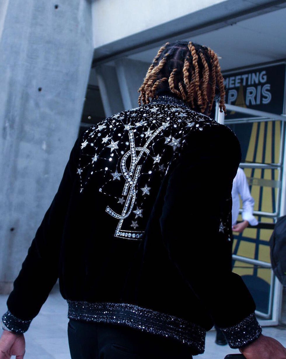 noah lyles wearing a fashionable jacket