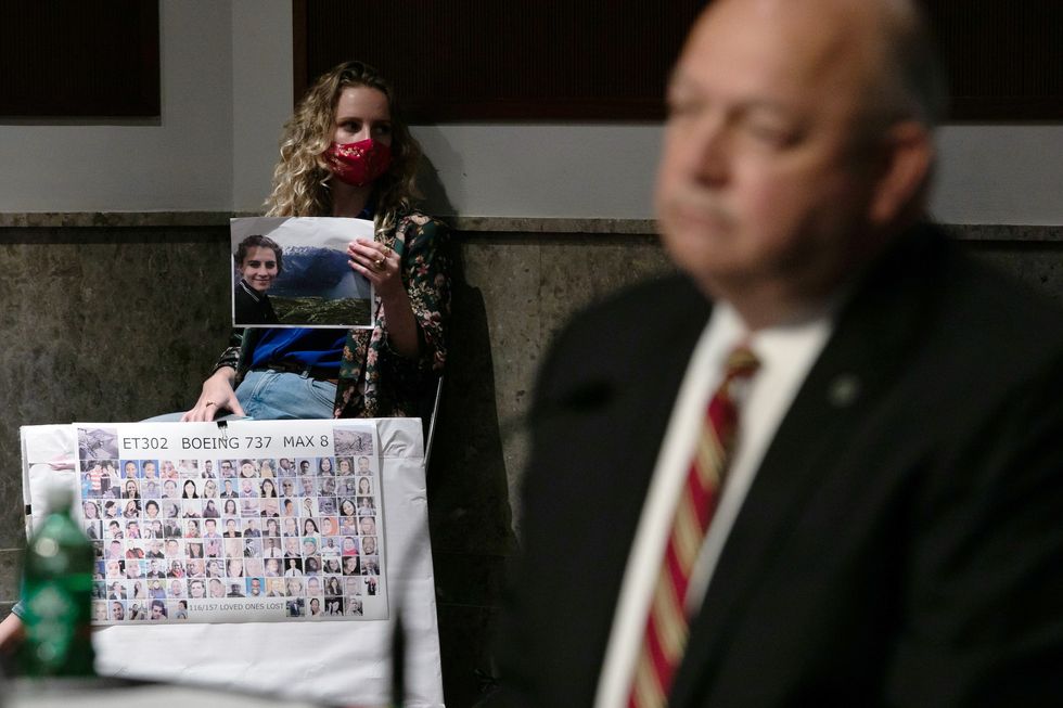 deveney williams holds a photograph of her friend, samya rose stumo who was killed in the march 10, 2019, crash of ethiopian airlines flight 302, as faa administrator stephen dickson prepares to testifies on capitol hill, in washington, wednesday, june 17, 2020, during a senate commerce, science and transportation committee hearing on "examining the federal aviation administration's oversight of aircraft certification"
