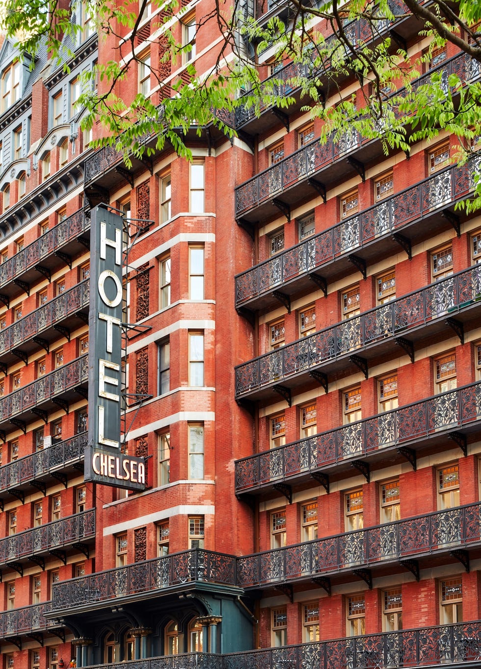 hotel chelsea with balconies and a sign on the side
