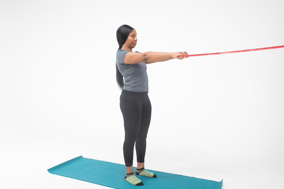 person performing an exercise with a resistance band