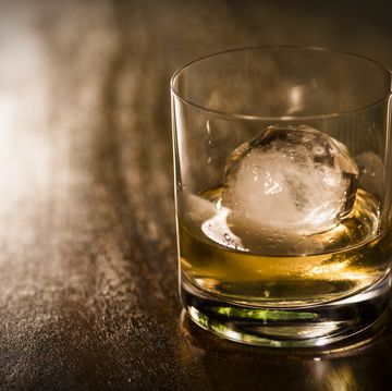 the cut glass contains whiskey and round ice