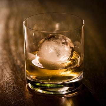 the cut glass contains whiskey and round ice