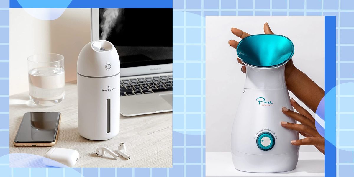 facial steamer on desk by laptop and smartphone and hand holding steamer