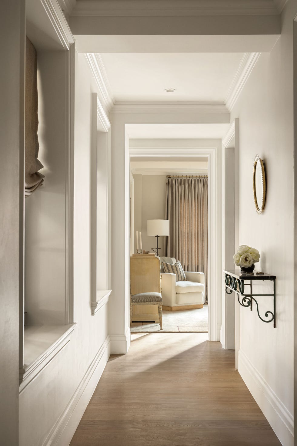 a hallway leading to a primary bedroom