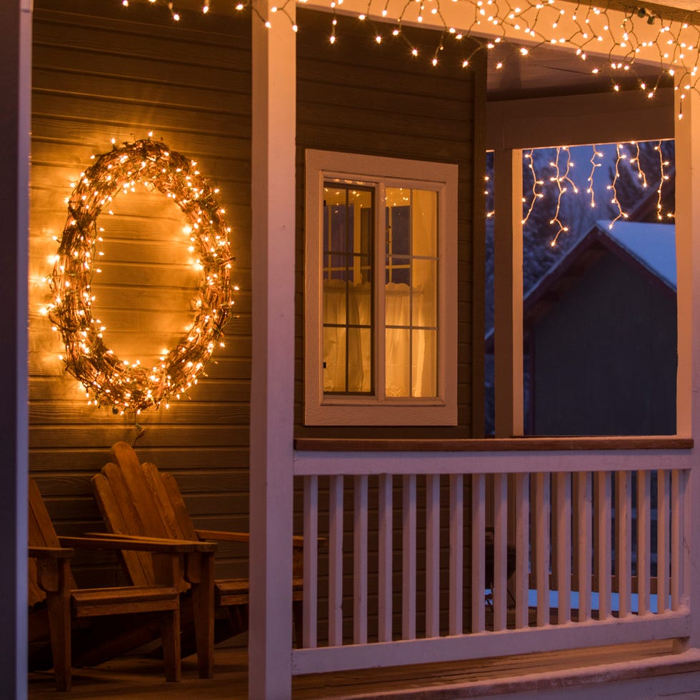 fairy lights and christmas wreath on house