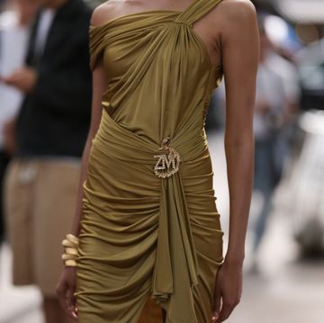 paris, france july 05 guest seen outside zuhair murad show wearing gold earrings, gold colored zuhair murad dress and gold bracelets during the haute couture fallwinter 20232024 as part of paris fashion week on july 05, 2023 in paris, france photo by jeremy moellergetty images