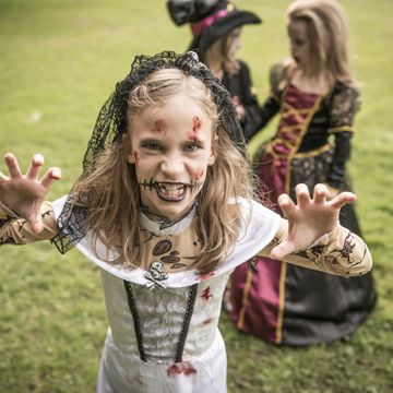 a child dressed in costume for halloween