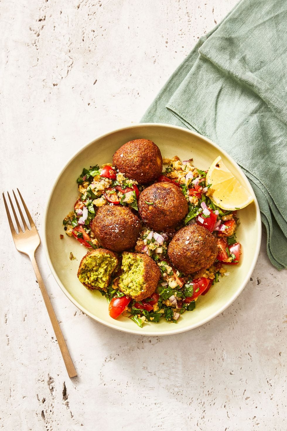 chopped salad with falafel in a bowl