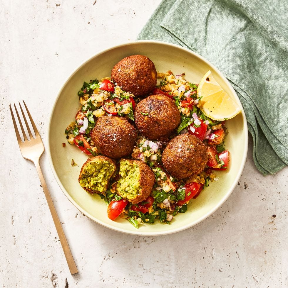 falafel chopped spring salad in a yellow bowl