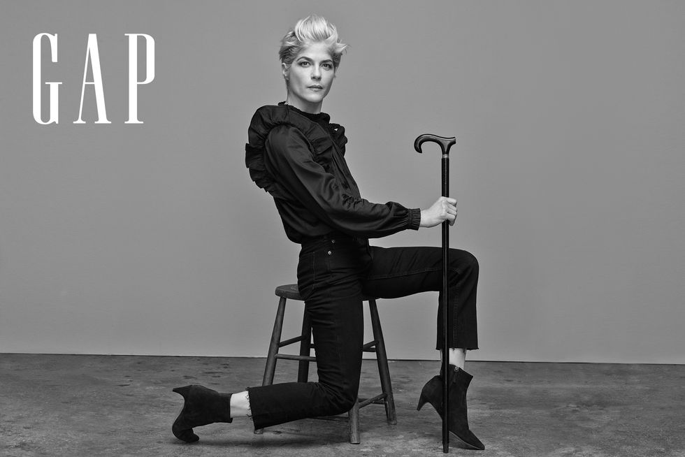 selma blair stars in gap’s fall campaign wearing jeans, black ankle boots, and her cane
